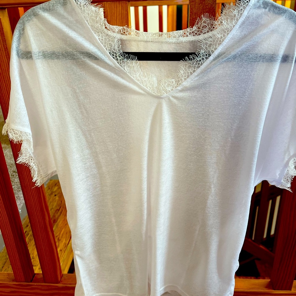 Flattering light shirt, size small, brand new and never worn